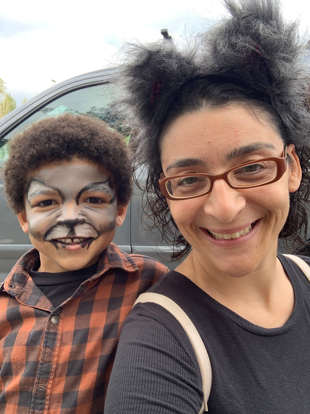 a woman and a boy with painted faces